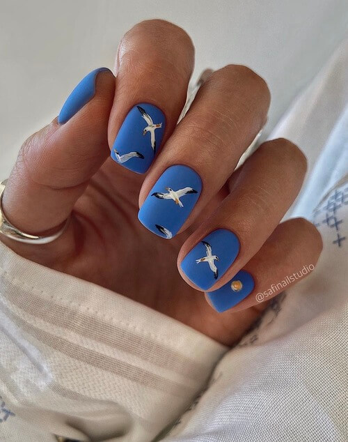 sky nail designs with vivid blue